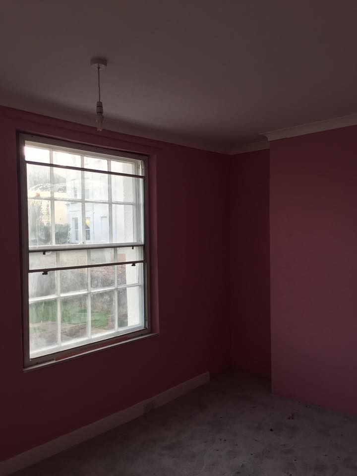 Room painted in a soft pink tone