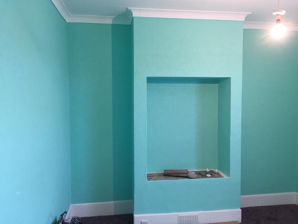 Living room with a turquoise feature alcove